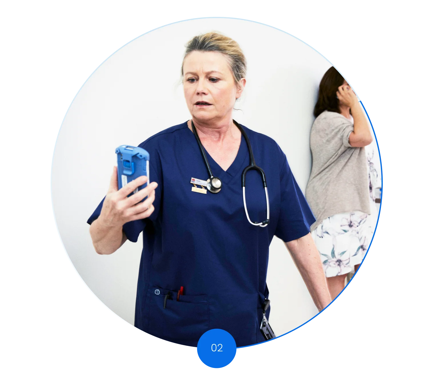 Nurse looking at messages on her mobile device